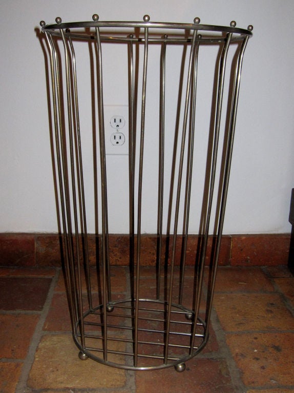 Elegant Umbrella Stand attributed to Jacques Adnet finished with balls at the top and on the feet.