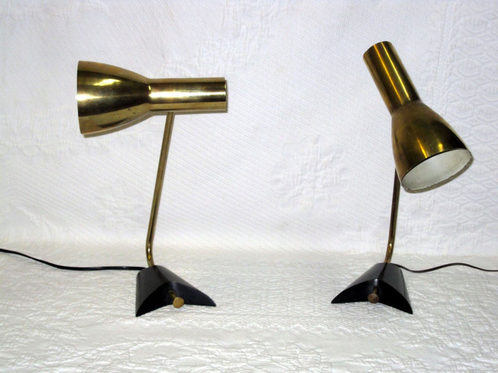 Pair of brass table lamps attributed to Stilnovo.
Very sturdy. Shades moves in all directions.
Base is black painted metal.