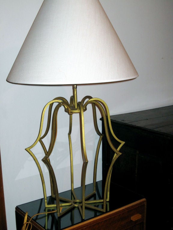 Pair of gilt wrought iron table lamps.

Pair has been re-wired with double cluster sockets - 
Adjustable height 34-38