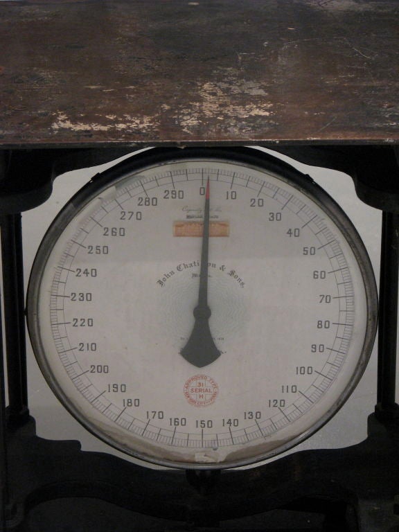 Industrial Scale Table<br />
John Chatillon & Sons weighing scale. Company dates back to 1835 in NYC. Patented 1878, manufacturing today. Beautiful form and functionality. steel welded table on wood plank with four caster wheels for ease of