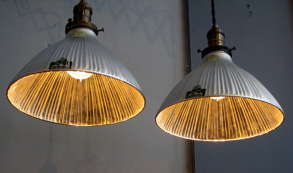 Mint condition Permaflector Co. mercury glass shades. no chips or surface scratches . Beautiful tulip shaped shades with matte silver exterior and silver mercury glass interior. Newly rewired with braided cloth cord and sockets. Adjustable drop. 9