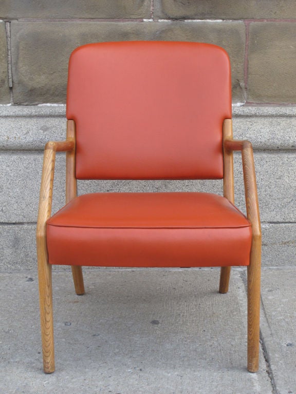 Pair of ash and orange leatherette upholstered armchairs.