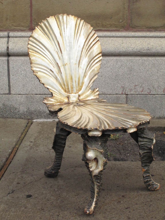 Outlandish Venetian silver-gilt and carved wood chair and table both in the form of open scallops, the legs decorated in coral and fantasy sea creature designs.<br />
<br />
Chair: H: 31'' W: 17'' D: 22