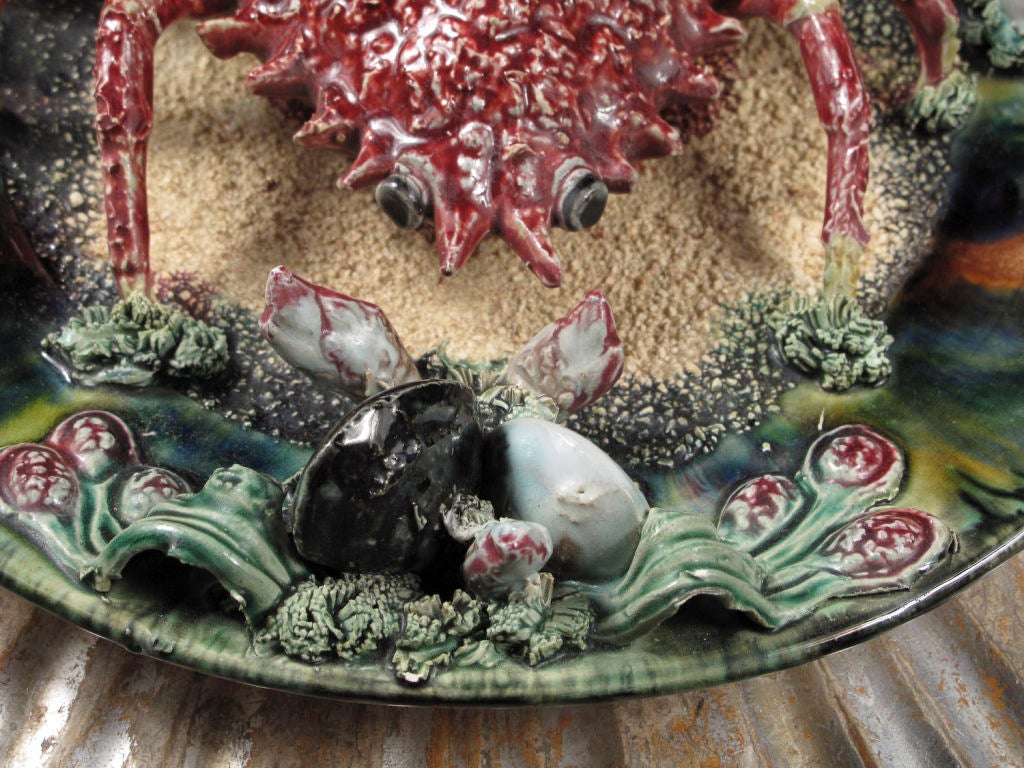 'Majolica' Palissy style ceramic plate decorated in relief with a crab and shells.