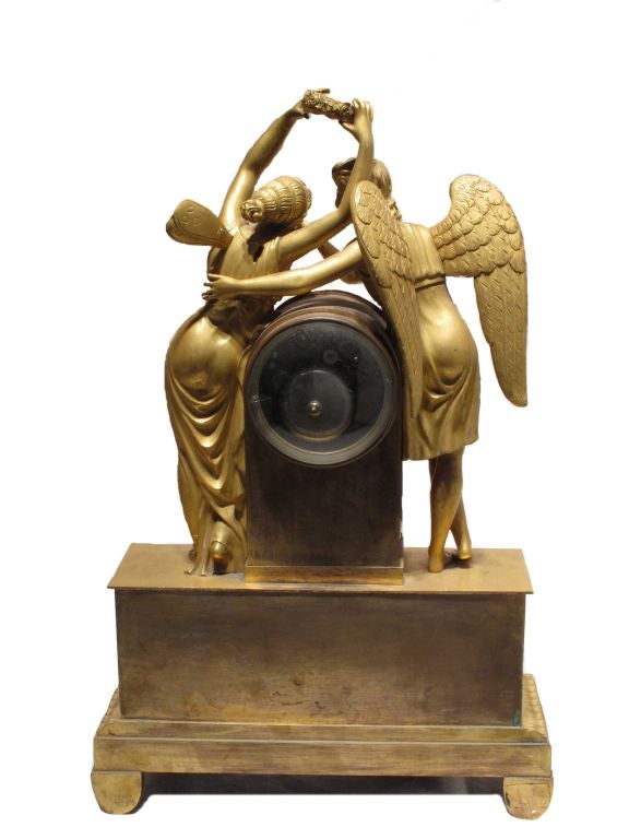 Empire period gilt bronze figural clock representing Amour & Psyche.