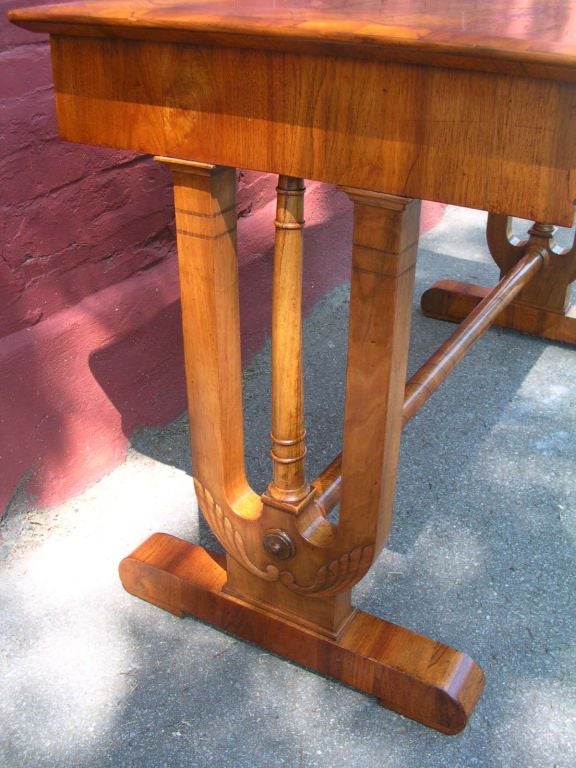 This beautiful  table is probably Russian, We describe it as a sofa table  but it might equally be for the library . (The drawer has ink stains) It is a fine piece of cabinetry with quarter- veneered surface, a frieze drawer and is raised on