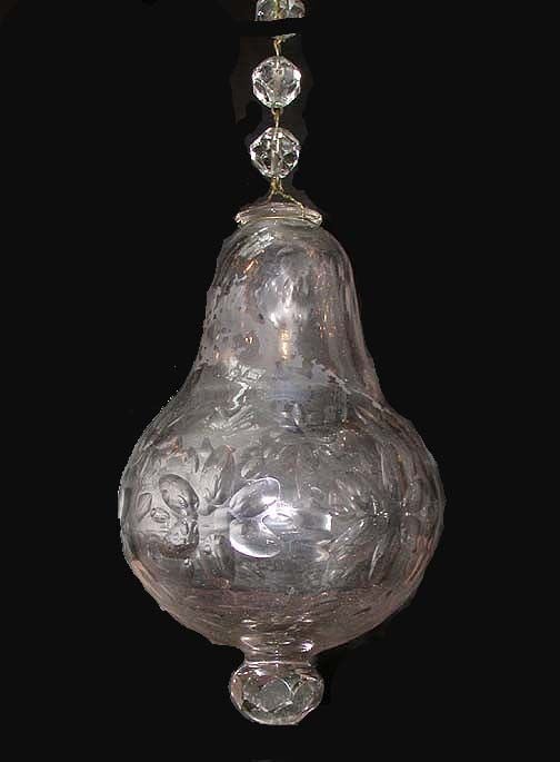 

This Baltic 18th century crystal and  six-arm  chandelier is hung
with antique crystal pendaloques in form of grape clusters, flowers and leaves.  
It has a blown and cut glass clad iron stem,  finishing with a large pear shaped blown and cut