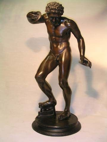 This famous bronze, known also as the Dancing Faun, is  Continental, and  a  19th century  bronze reduction of the original by Massimiliano Soldani-Benzi (Italian 1656-1740). He himself worked from a Roman version that referenced a Greek original