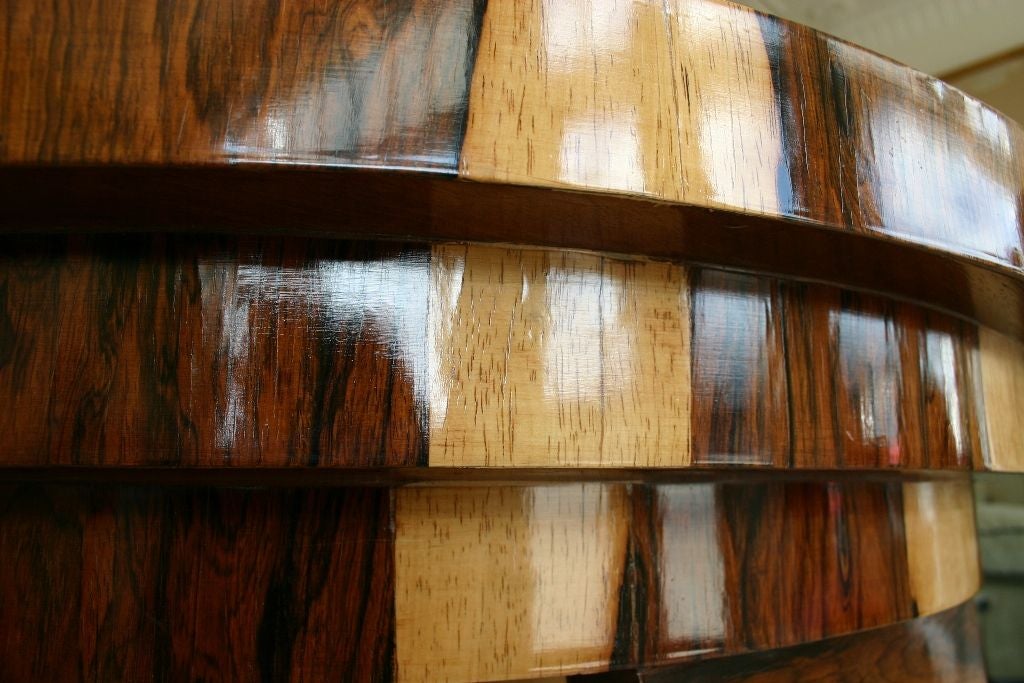 Fine Pair of Art Deco Style Demilune Consoles in Brazilian Rosewood, with stepped tops and bases, broken-pediment and S-curve supports.