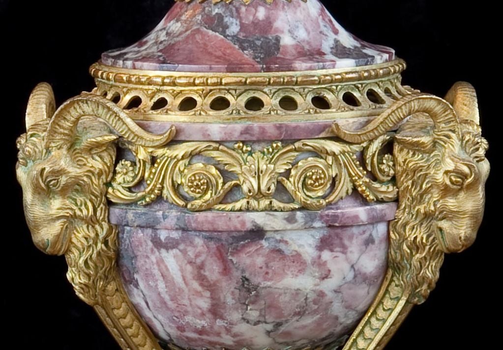 A magnificent pair of late 18th century Louis XVI ormolu mounted variegated purple marble perfume burners.