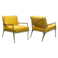 A Pair of Polished Aluminum Arm Chairs