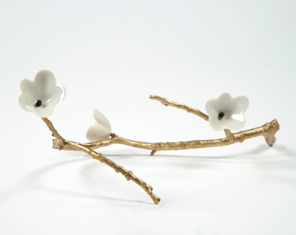 Unique bronze table branch with three porcelain blossoms. Designed and made by David Wiseman, USA, 2008. (other similar branches also available)