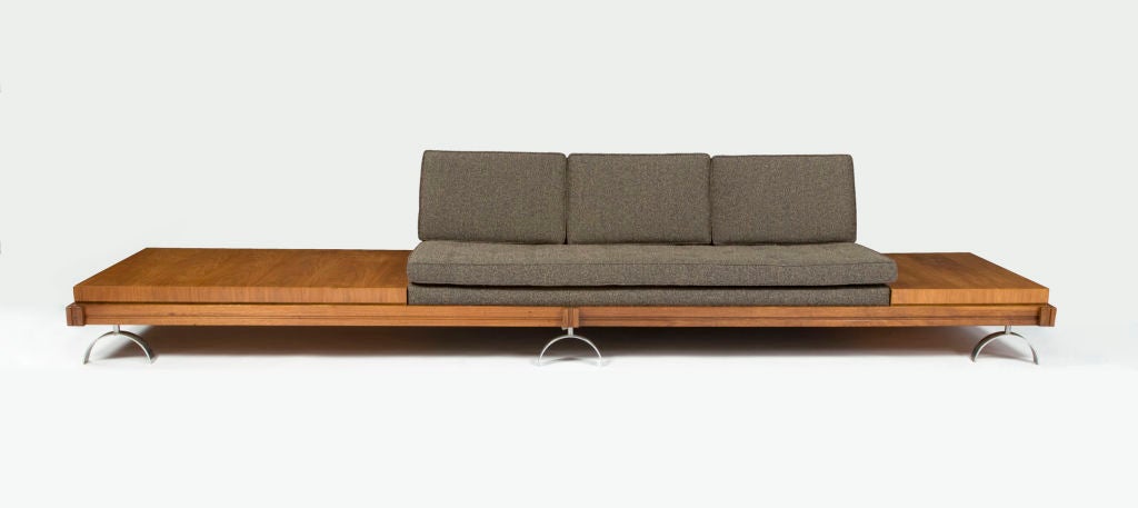 Two-piece sectional sofa from the 'Challenge' series. Designed by Martin Borenstein, AIA, IDA of MB Designs for Croyden Furniture Inc., New York. Walnut and stainless steel. Los Angeles, California, 1952. Three-seat section: 27