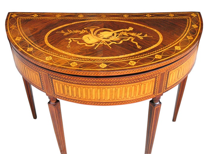 This magnificent Italian Louis XVI card table is a piece is attributed to Giuseppe Maggiolini (1738-1814), most important ebonist in Italian Neo-Classicism. Marquetry with maple, box tree, exotic woods and palisander, depicting foliage, flowers,