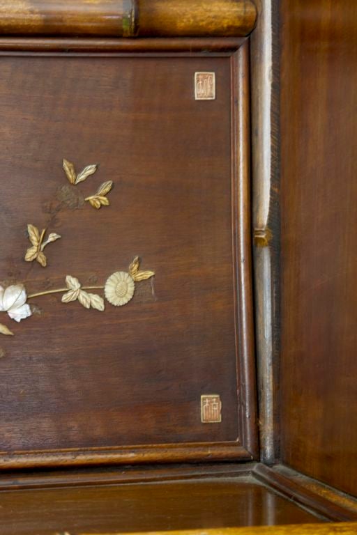 Bamboo 19th Century bamboo display cabinet with oriental panels