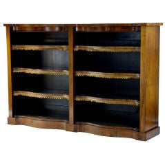 19th century rosewood double serpentine open bookcase