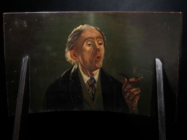Unusual arts and crafts siting chair with unique oil painting depicting it's use as a smoking chair.