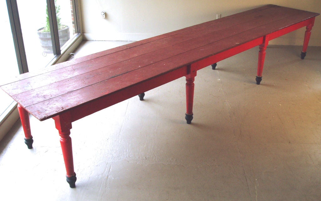 a fantastic wide plank 16' long farm table from a rectory in Maine. great old red paint and worn with a great patina.