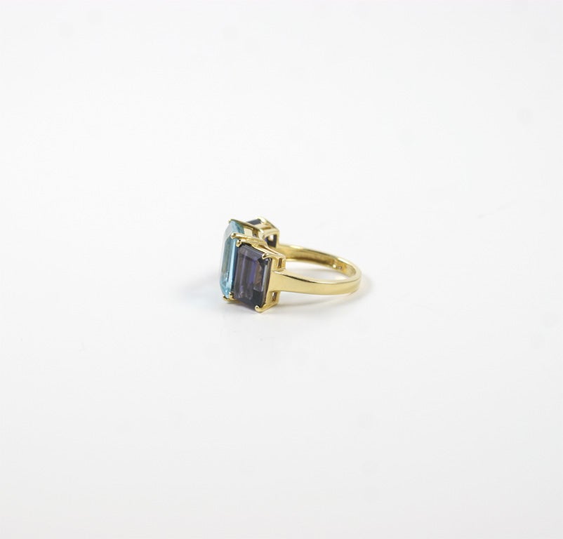 Contemporary 18kt Yellow Gold Emerald Cut Ring with Blue Topaz and Iolite For Sale