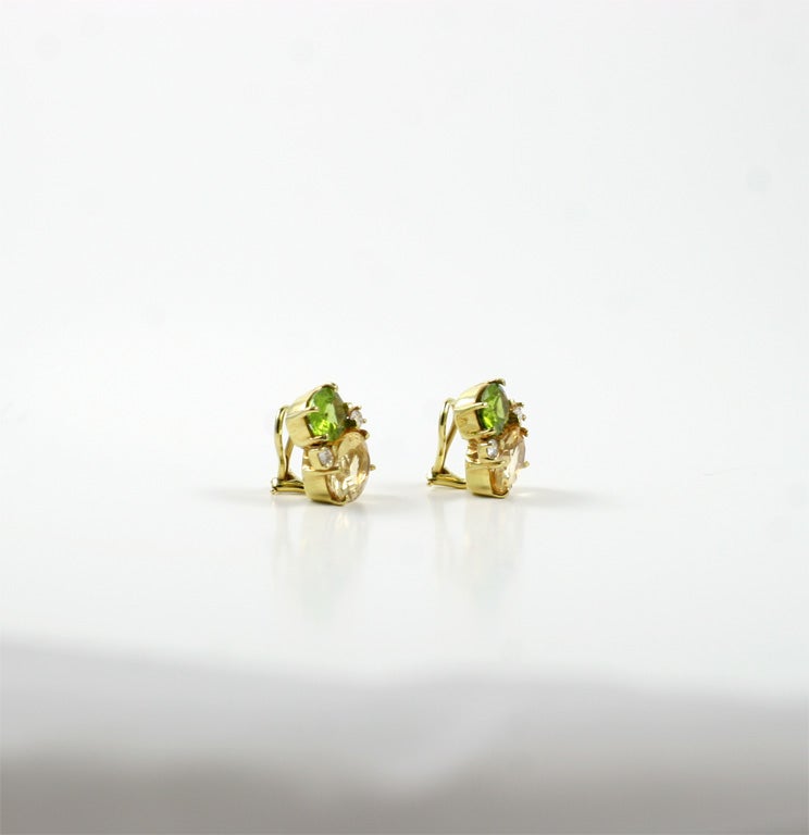 Medium 18kt yellow gold GUM DROP™ earrings with peridot (approximately 2.5 cts each), citrine (approximately 5 cts each), and 4 diamonds weighing 0.40 cts.

Specifications: Height: 3/4