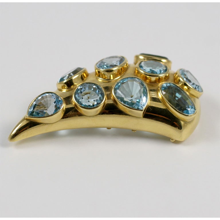 An oval Aquamarine gold set Cornucopia pin of wonderful proportion by Solange Azagurry Partridge.