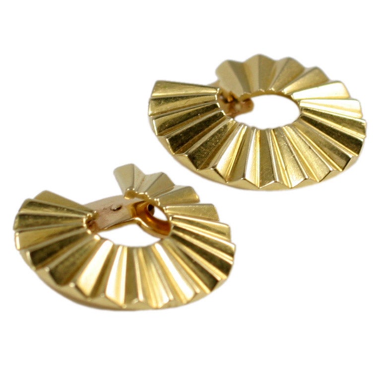 A rare of pair of gold earclips designed by Madame Belperron for Rene Boivin accompanied by a letter from expert Francoise Cailles that the earclips were made in 1932 by Boivin and the model was styled 