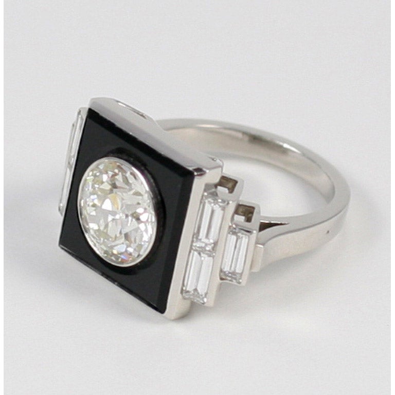 Art Deco diamond and onyx tablet and stepped shoulder platinum ring,  center is 2.19 ct with 6 baguettes at approx 0.90 ct