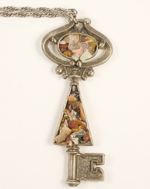 Art stone encrusted large key pendant necklace in slivertone.  24
