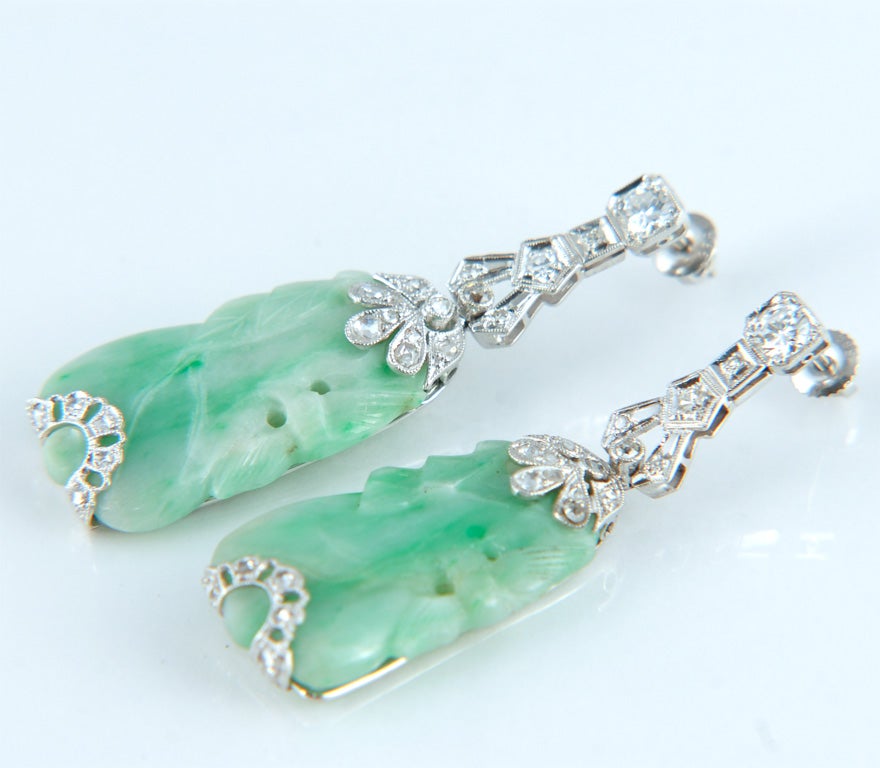 Art Deco Period Platinum, Antique Carved Jade and Diamond Earrings.<br />
c. 1925-30<br />
Diamonds=1.60 Carats