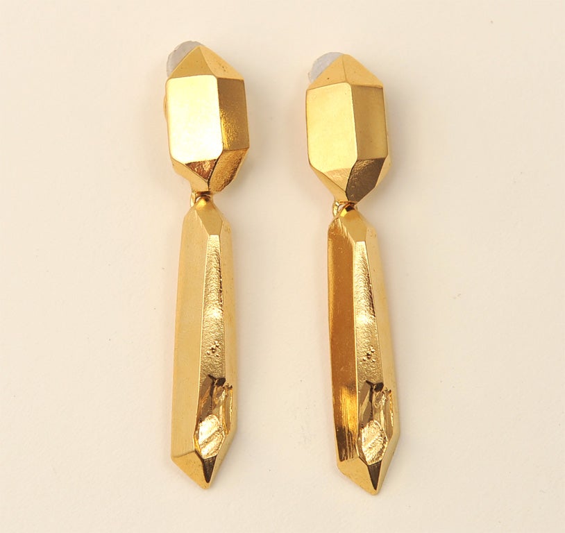 THIS WONDERFUL PAIR OF ARCHITECTURAL GILT OVER METAL EARRINGS BY YVES ST LAURENT ARE SIGNED YSL ON THE TOP OF EACH CLIP