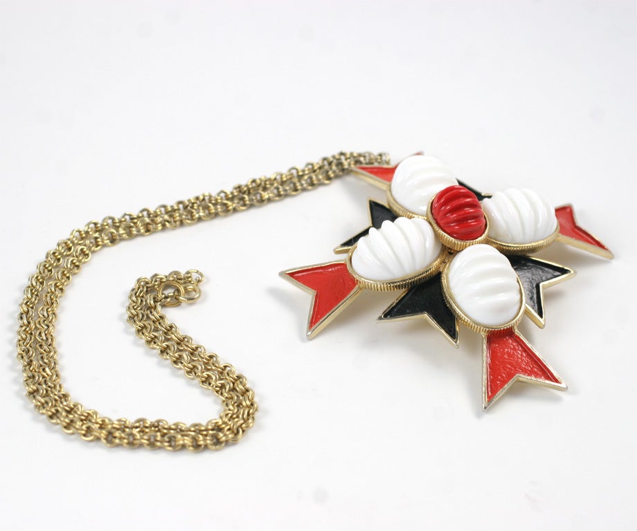 Large Maltese cross of black and red enamel with white and red ribbed cabochons set in gilt metal suspended from a 24