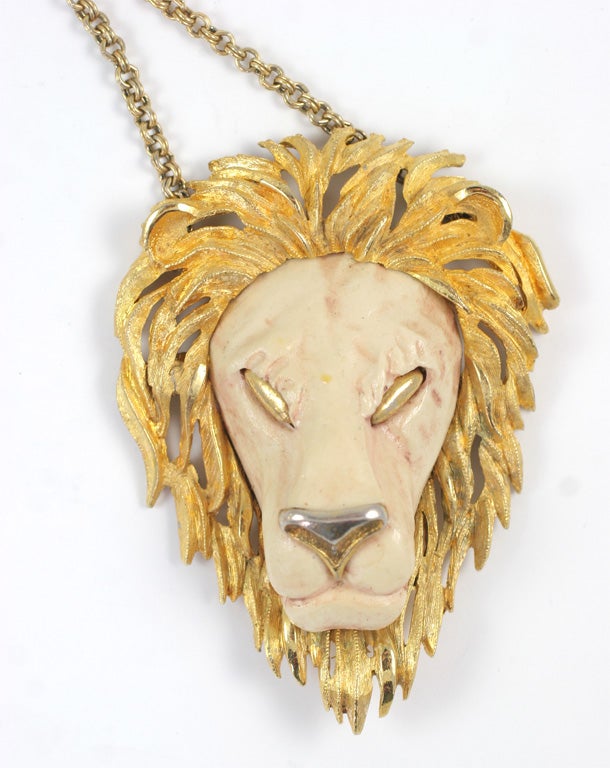Large resin and gilt metal lion head pendant on 29