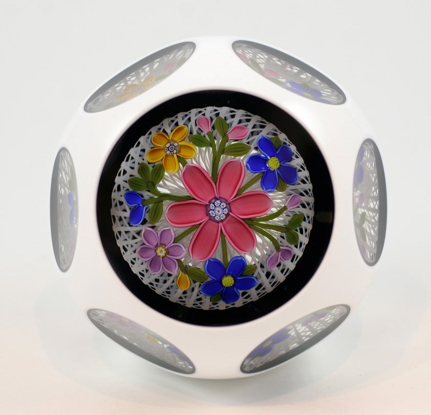 Peter McDougall white on black double overlay paperweight with a bouquet on white latticinio
