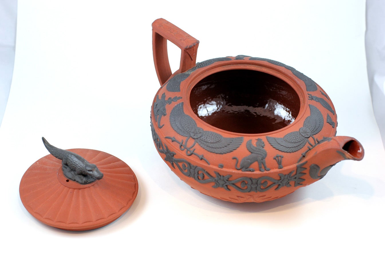 A fine Wedgwood rosso antico and basalt teapot with Egyptian motifs, upper case mark