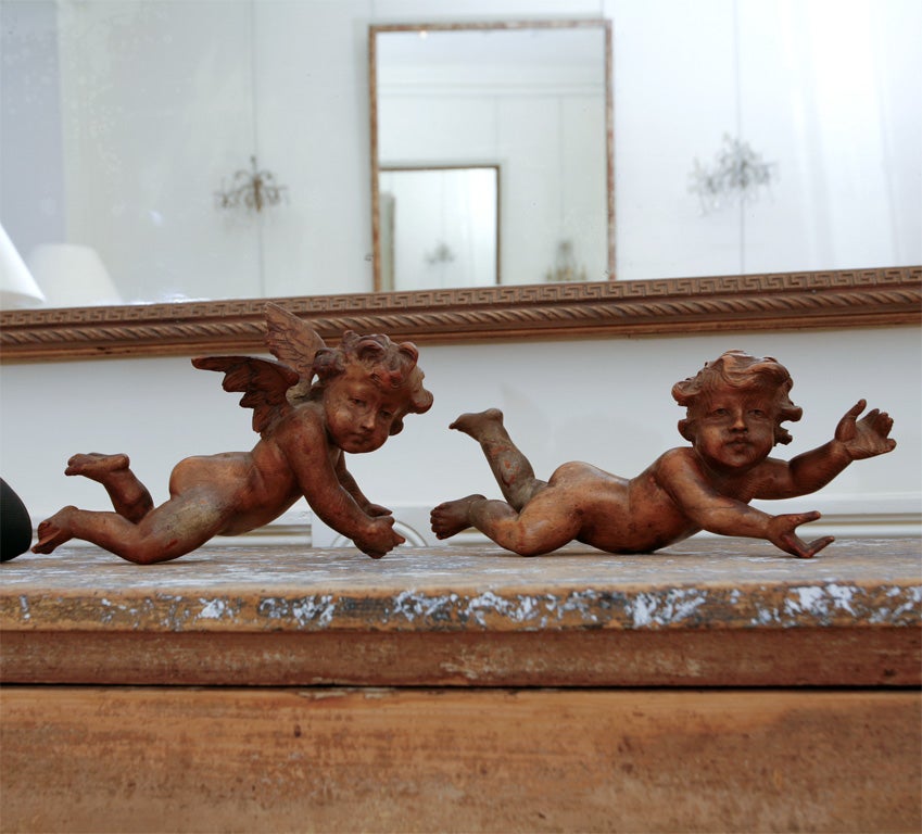 Set of three 18thC carved limewood cherubs