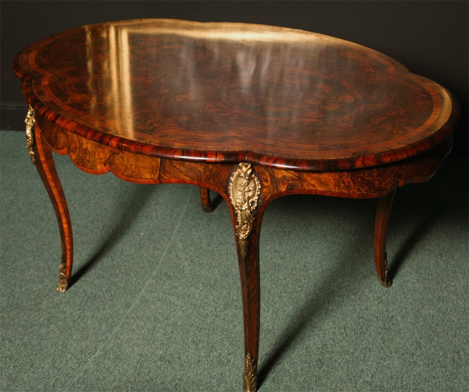 A superb English ladies writing table or sofa table.