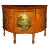 A painted satinwood demi lune buffet