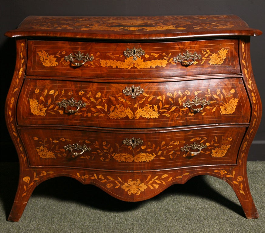 A Dutch marquetry bombe shaped commode