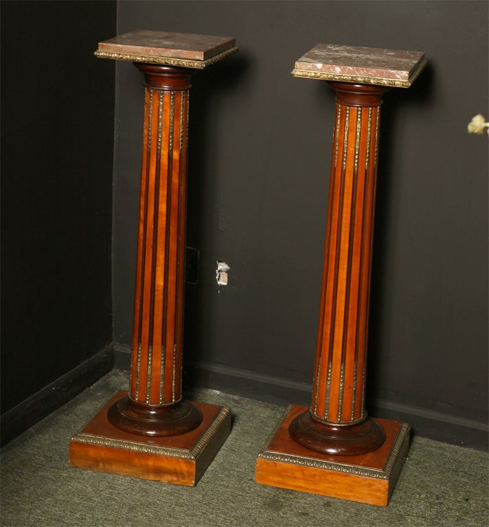 A pair of 19th century pedestals with gilt bronze decoration
