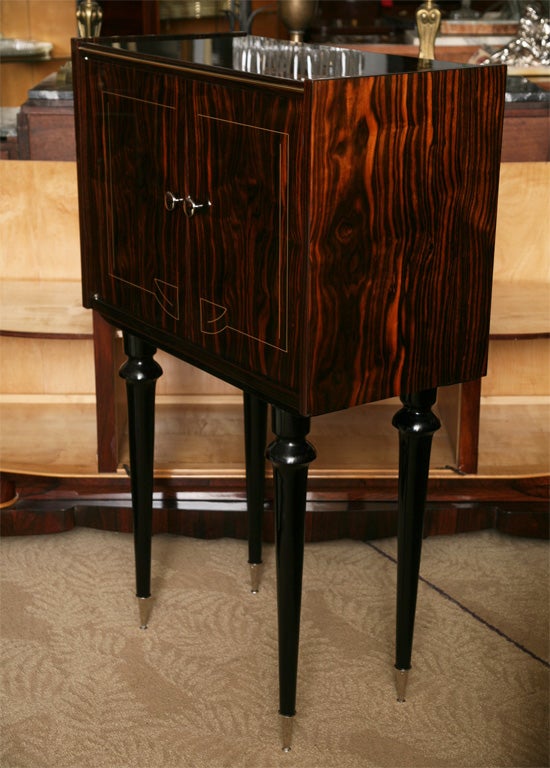 Tall Exotic Macassar Ebony French Art Deco Bar/ Cabinet in a Very Hard to Find Size/ Style. The epitome of elegance, France, 1940's. High Polish Nickel Plated Accents, interior Finished Lemonwood.
