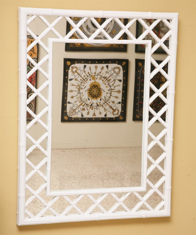 SOLD MARCH 2011... Reticulated crisp white lacquered carved faux bamboo defines this large mirror with a double thick bamboo outer frame, latticed bamboo to the inner bamboo frame, all over mirror.  Delightful, clean and airy.  Palm Beach and