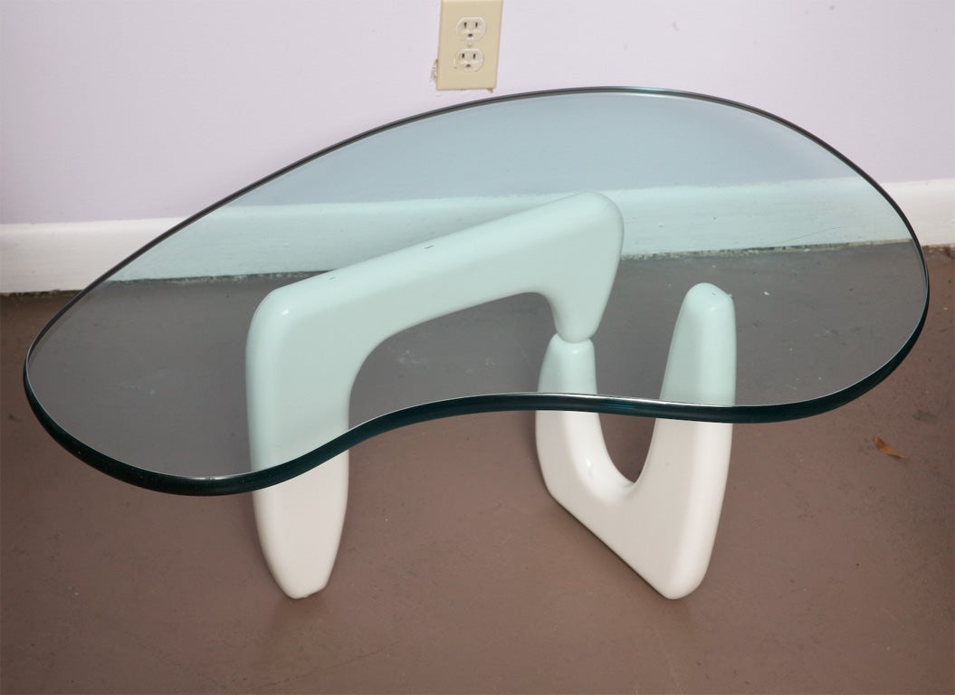 We don't know that Noguchi ever executed a miniature version of his iconic coffee table, but this would certainly be it if he did. The original -and badly damaged- finish was a circa 1950's paint over gesso. The pair have been restored and given a