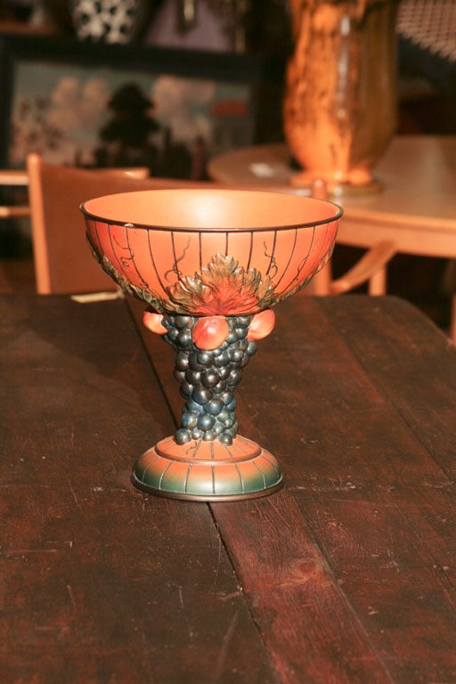 Fruit compote from the Ipsen pottery factory in Denmark, c 1930's in their distinctive orange hue, depicting grapes and grapeleaves intertwined on the stem.