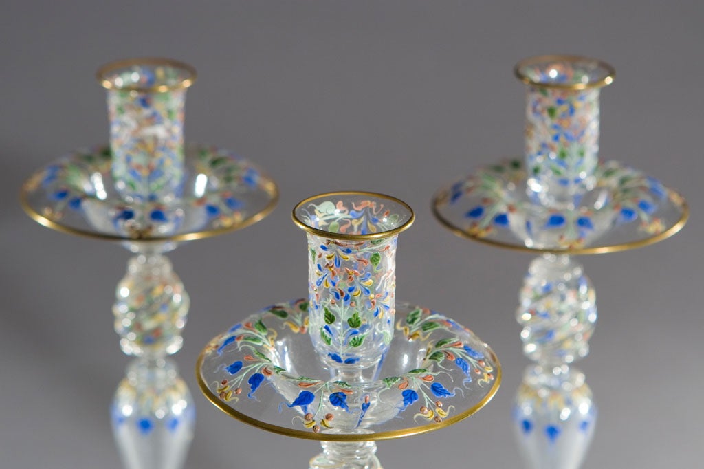 An unusual beautiful matched set of 4 hand blown Venetian candlesticks would grace any tablesetting- These could be used in a tight grouping as the centerpiece or spread down the center of the table with another option for flowers. The bobeches,