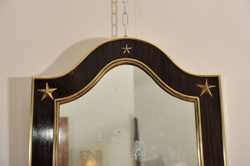 Elegant brass and mahogany mirror.