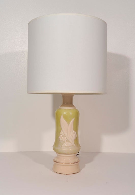 Pair of Heavy Vaseline Glass Lamps with a chartreuse overglaze and Lilly of the Valley motif. Lamps feature a 3 way switch to allow the base to illuminate internally. Visit Quotientnyc.com to view our complete collection.