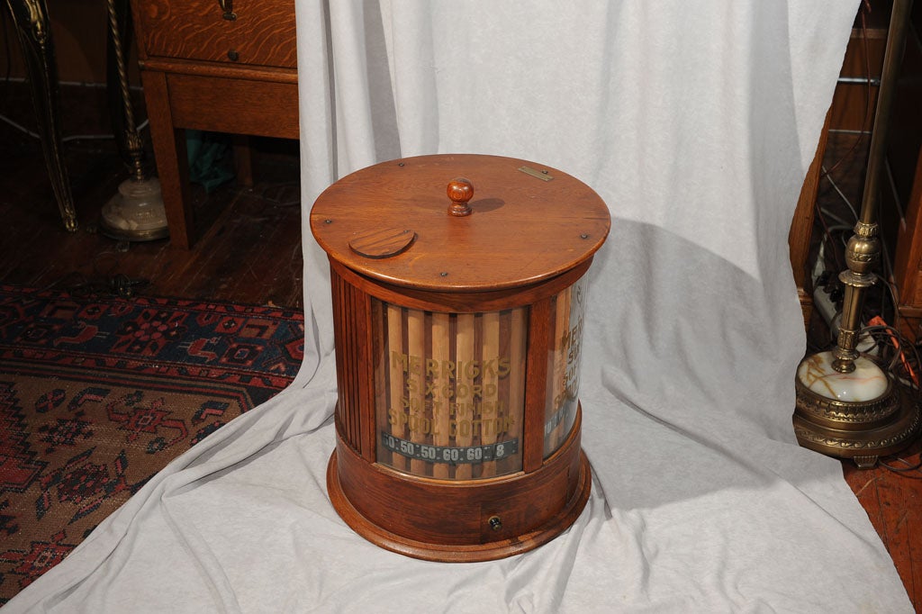 This rare, rare fabulous spool cabinet has the original finish on the oak and the original curved glass with the advertising all still intact.  You can't find one in bettr condition.  People use them as end tables or for storage of smalls.  This is