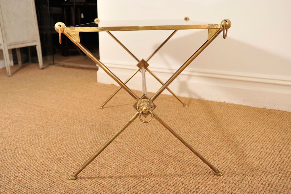 1940s French Brass Coffee Table in the Bagues Style, with a black glass top<br />
<br />
To see similar items in our inventory, please visit Suzannegoldenantiques.com