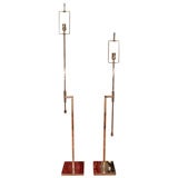 Pair of adjustable chrome floor lamps