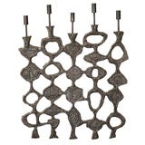 Abstract aluminum wall applique with candlesticks by Donald Drum